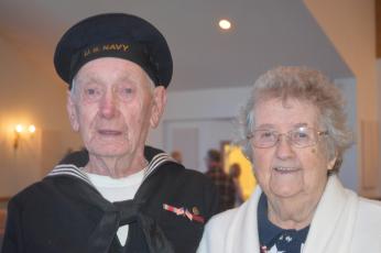  (Progress photo by Lorrie Ross)  A Navy veteran of World War II, Hoke Henson of Peachtree, led the Pledge of Allegiance during the 2018 Veteran's Day ceremony and stood proudly with his wife after the solemn service. Hoke Henson was Navy Fire and Rescue. As they posed for the picture, Edith Henson smiled and said, "We have been married 71 years."