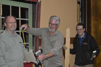 (Pam Roman •  Submitted) Set builders, from left, Jim Oliver, Stan Rasmussen and Sean Rice enjoy socializing while constructing the latest set at the Peacock Performing Arts Center.