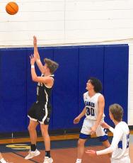Gary Corsair • Progress Hayesville's Isaac Chandler drops in 2 of his game-high 22 points against Hiwassee Dam.