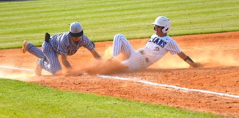 Gary Corsair • Clay County Progress Hayesville third baseman Chance Hughes lunges to tag a base runner during a fifth inning rally by Towns county. The nearest umpire ruled that Hughes made the tag in time, much to the consternation of Towns County coaches, players and fans.