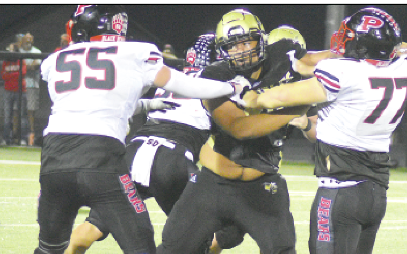 Gary Corsair • Clay County Progress Hayesville tackle Dante Robinson, No. 58, is too much for most lineman to handle one-on-one, as Pisgah learned Friday night. In fact, it's difficult to contain the Yellow Jacket senior without holding him.